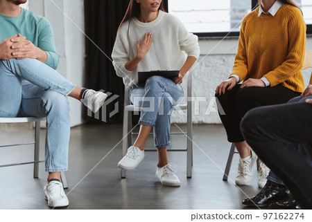 Psychotherapist working with patients in group therapy session, closeup 97162274