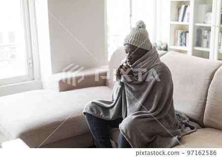Black man freezing in house in winter, copy space 97162586