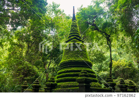 Ancient pagoda with moss plant at Phlio waterfall park, Chanthaburi 97162862