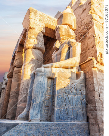 Seated Rameses II Statue at the entrance of Luxor Temple, Egypt 97163075
