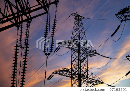Electricity pylon (high voltage power line), black contour, against the background of a romantic evening sky Electricity pylon (high voltage power line), black contour, against the background of a romantic evening sky 97163301