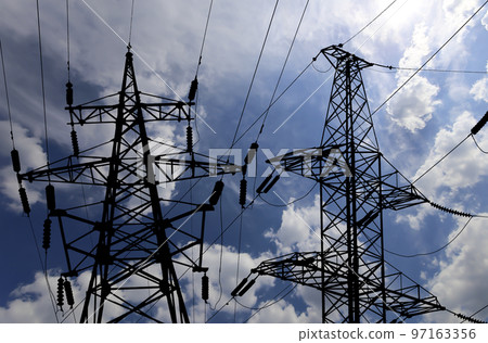 Electricity pylon (high voltage power line), black contour,  on the background of the cloudy sky 97163356