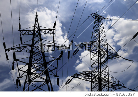 Electricity pylon (high voltage power line), black contour,  on the background of the cloudy sky 97163357
