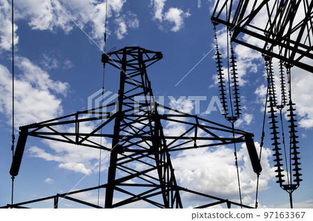 Electricity pylon (high voltage power line), black contour,  on the background of the cloudy sky 97163367