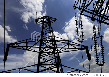 Electricity pylon (high voltage power line), black contour,  on the background of the cloudy sky 97163372