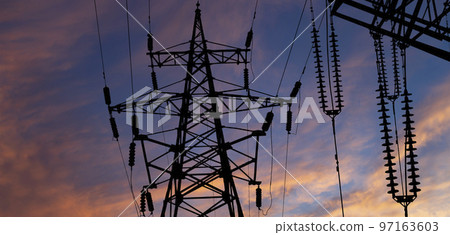 Electricity pylon (high voltage power line), black contour, against the background of a romantic evening sky Electricity pylon (high voltage power line), black contour, against the background of a romantic evening sky 97163603