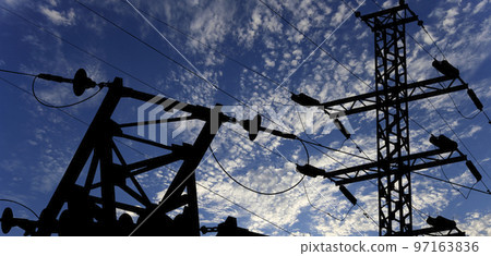Electricity pylon (high voltage power line), black contour,  on the background of the cloudy sky 97163836