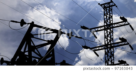 Electricity pylon (high voltage power line), black contour,  on the background of the cloudy sky 97163843