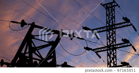 Electricity pylon (high voltage power line), black contour, against the background of a romantic evening sky Electricity pylon (high voltage power line), black contour, against the background of a romantic evening sky 97163851