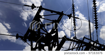 Electricity pylon (high voltage power line), black contour,  on the background of the cloudy sky 97163876
