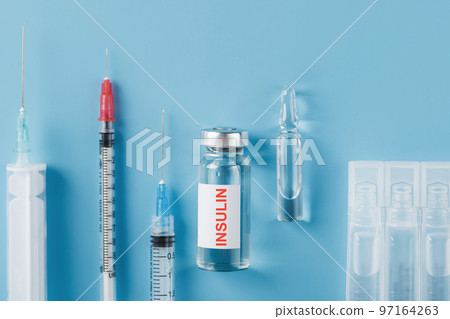 Medicine in ampoules with insulin, needles and syringes for medical subcutaneous injection Medicine in ampoules with insulin, needles and syringes for medical subcutaneous injection 97164263