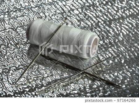 Thread on a silver background 97164266