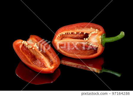 Fresh red pepper. Reflection on a black background 97164286
