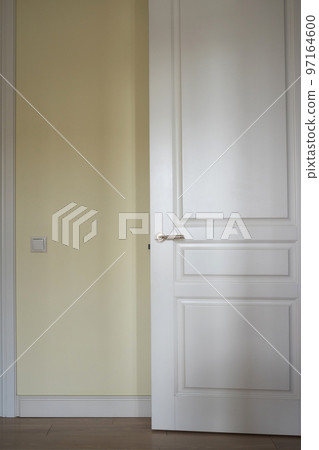 White door in the light beige room 97164600