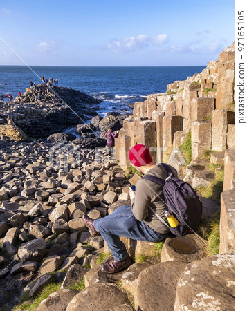 The Giant's Causeway, 40000 interlocking basalt columns, by Bushmills in Northern Ireland, United Kingdom The Giant's Causeway, 40000 interlocking basalt columns, by Bushmills in Northern Ireland, United Kingdom 97165105