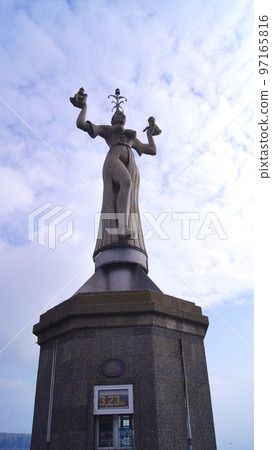 KONSTANZ, GERMANY - OCT 14, 2015: Imperia is a statue in the harbour of Konstanz on Lake Constance. The figure, which was erected in 1993, is cast in concrete, nine metres high, weighs 18 tonnes and KONSTANZ, GERMANY - OCT 14, 2015: Imperia is a statue in the harbour of Konstanz on Lake Constance. The figure, which was erected in 1993, is cast in concrete, nine metres high, weighs 18 tonnes and 97165816
