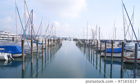 KONSTANZ, GERMANY - 14 OCTOBER 2015: Harbour with small boats and sailing yachts of Konstanz at Lake Constance KONSTANZ, GERMANY - 14 OCTOBER 2015: Harbour with small boats and sailing yachts of Konstanz at Lake Constance 97165817