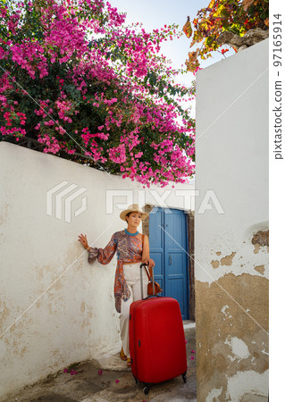 Young woman came to the island of Santorini 97165914