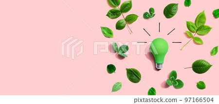 Green light bulb with green leaves 97166504