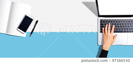 Person using a laptop computer Person using a laptop computer 97166530