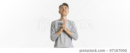Image of nervous middle-aged man begging God, looking up and pleading for something, supplicating over white background 97167008