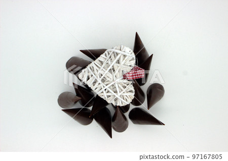 Elongated chocolates on white background Elongated chocolates on white background 97167805