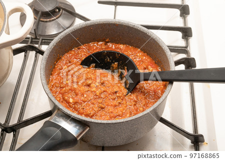 Meat sauce being cooked 97168865