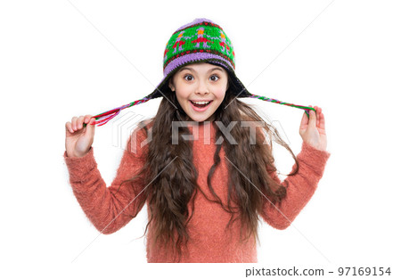 winter fashion for amazed teen girl. winter knitwear. teen girl model in earflap hat. teen girl winter fashion for amazed teen girl. winter knitwear. teen girl model in earflap hat. teen girl 97169154