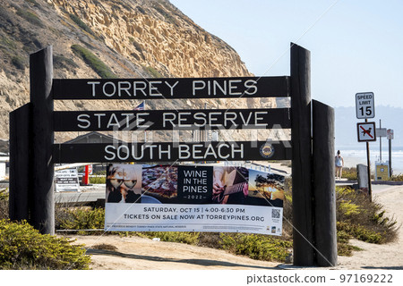 San Diego, USA. September 20, 2022. Sign boards and advertisement posters with mountain in the background at Torrey Pines State Reserve San Diego, USA. September 20, 2022. Sign boards and advertisement posters with mountain in the background at Torrey Pines State Reserve 97169222