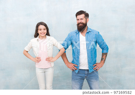 Fatherhood changes a man. Happy man and little girl. Bearded man and small child smiling on grey background. Caucasian man with his daughter Fatherhood changes a man. Happy man and little girl. Bearded man and small child smiling on grey background. Caucasian man with his daughter 97169582