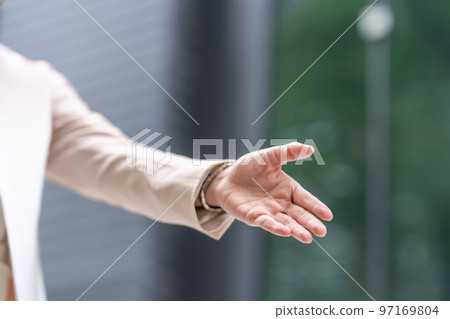 Business woman shaking hands Business woman shaking hands 97169804