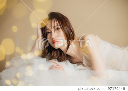 A woman in a beige dress 97170446