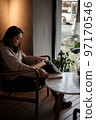 asian female student performs homework 97170546
