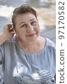 Portrait of a friendly elderly woman 97170582