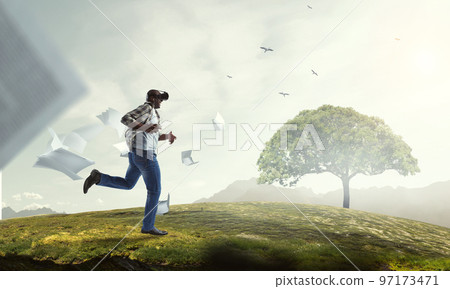 Man wearing virtual reality goggles 97173471