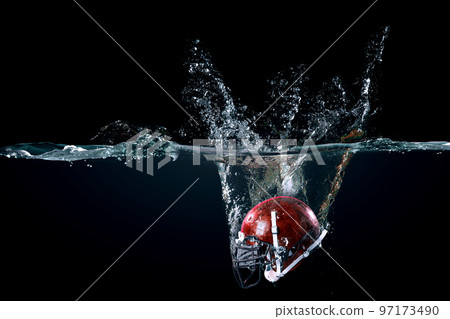 American football helmet in water American football helmet in water 97173490