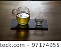 Green tea poured into a glass pot 97174955