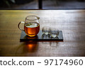 Oriental beauty tea in a transparent glass 97174960