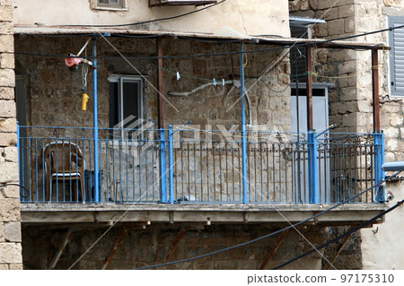 Balcony - a platform with railings protruding on the upper floors of the building. Balcony - a platform with railings protruding on the upper floors of the building. 97175310
