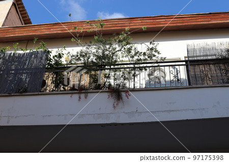 Balcony - a platform with railings protruding on the upper floors of the building. Balcony - a platform with railings protruding on the upper floors of the building. 97175398
