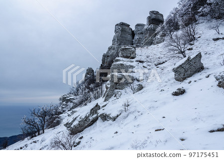 Mount Alenga near Southern Demerdzhi in snow and ice in spring. Crimea Mount Alenga near Southern Demerdzhi in snow and ice in spring. Crimea 97175451