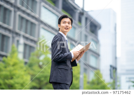Businessman with files Businessman with files 97175462