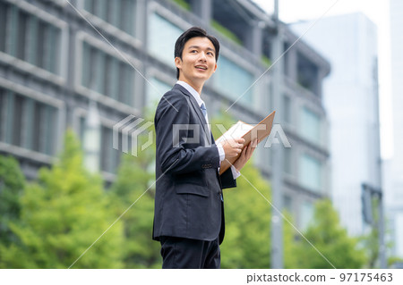 Businessman with files Businessman with files 97175463