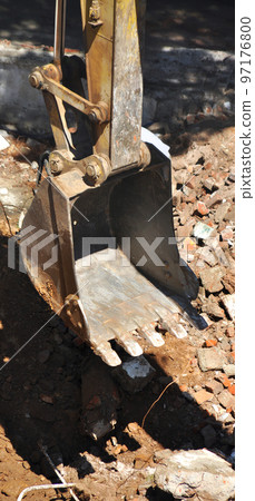 Excavator continues to work at the construction site 97176800