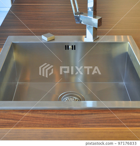 Interior of modern kitchen and stainless steel sink, tap and drain 97176833