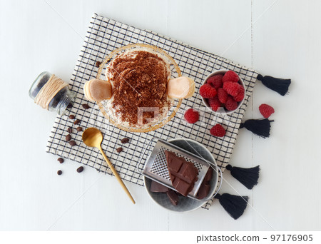 Easy and quick homemade raspberry tiramisu for unexpected visit, sweet no bake cheesecake style dessert with ingredients placed on white wooden table. Easy and quick homemade raspberry tiramisu for unexpected visit, sweet no bake cheesecake style dessert with ingredients placed on white wooden table. 97176905