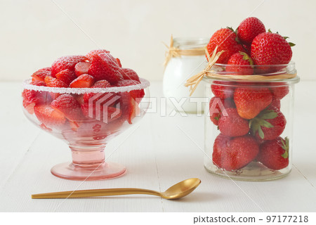 Tasty fresh strawberries in a glass bowl with creme fraiche 97177218