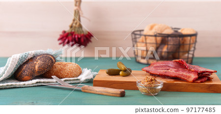 Tasty and nutritious bacon snack with cornichons Tasty and nutritious bacon snack with cornichons 97177485