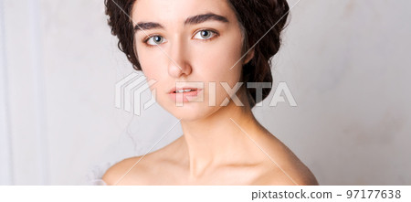 Studio portrait beautiful young woman with brown hair. Cute model girl 97177638