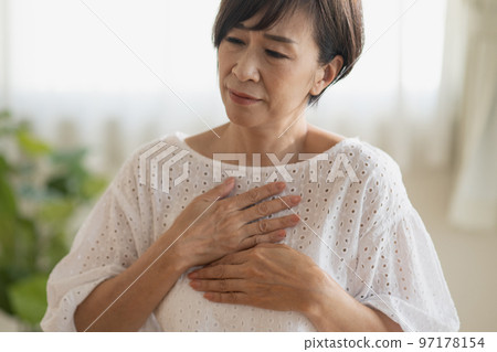 Image of a Japanese woman feeling nervous and palpitating Image of a Japanese woman feeling nervous and palpitating 97178154